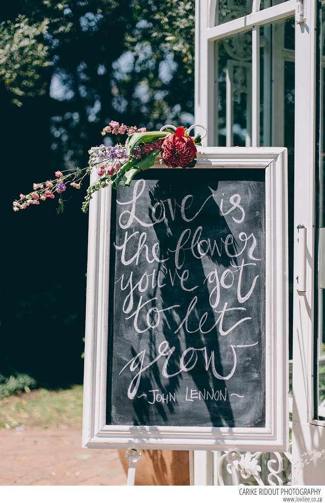 Wedding welcome sign on a black board with hand-lettering