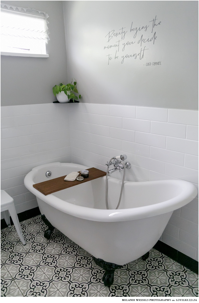 Bathroom with white subway inspired tiles and victorian style bath by Union Tiles