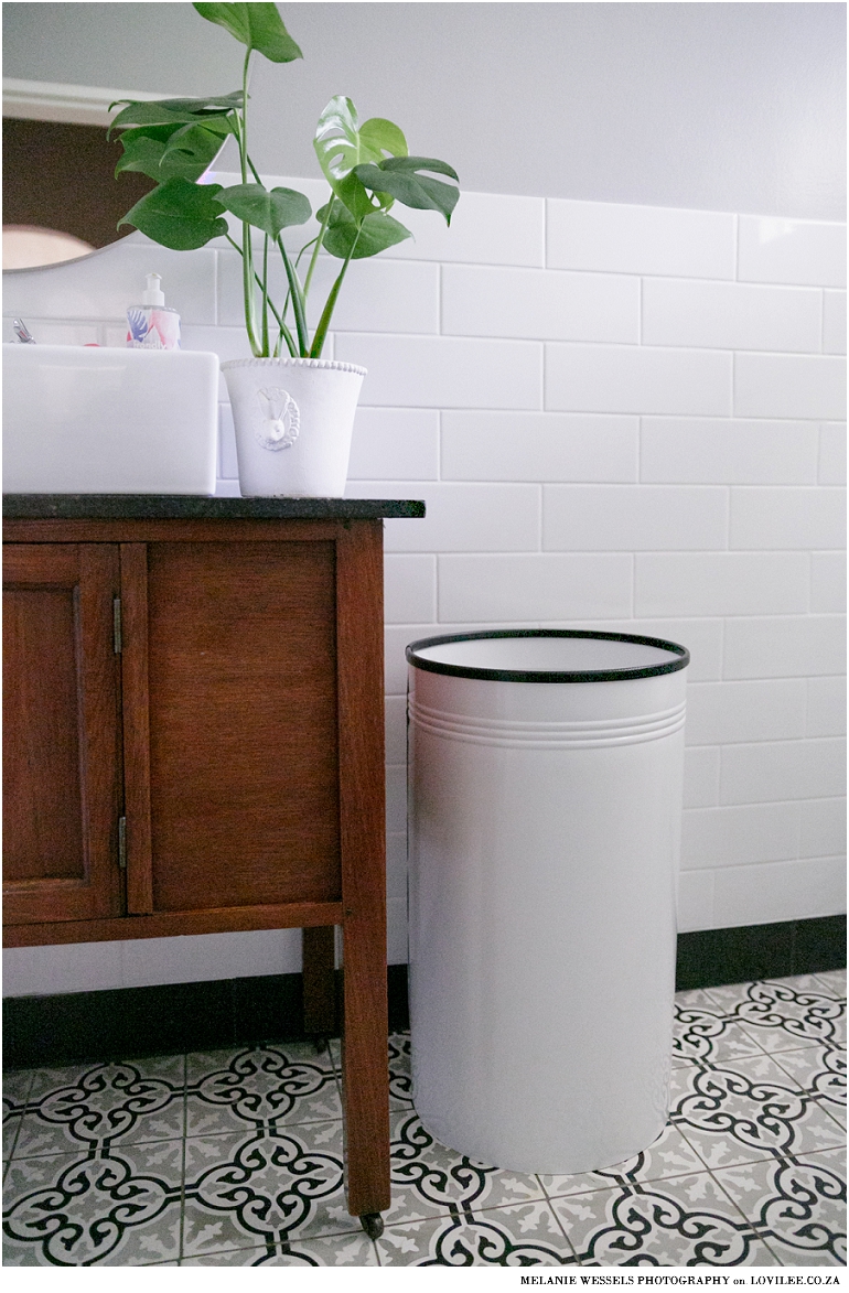 Old wash table upcycled as bathroom vanity with a pedersen lennard clothes bin