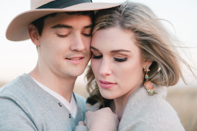 Serene winter engagement shoot with pops of green