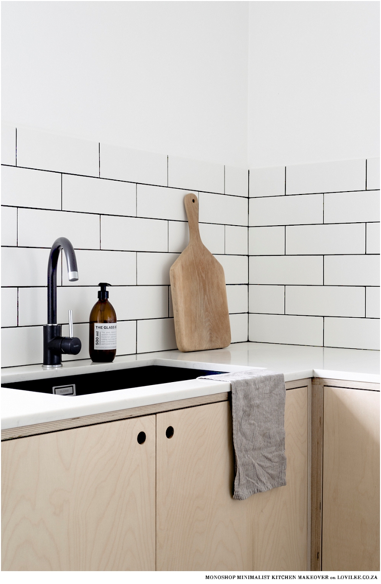 Minimalist kitchen makeover with black tap