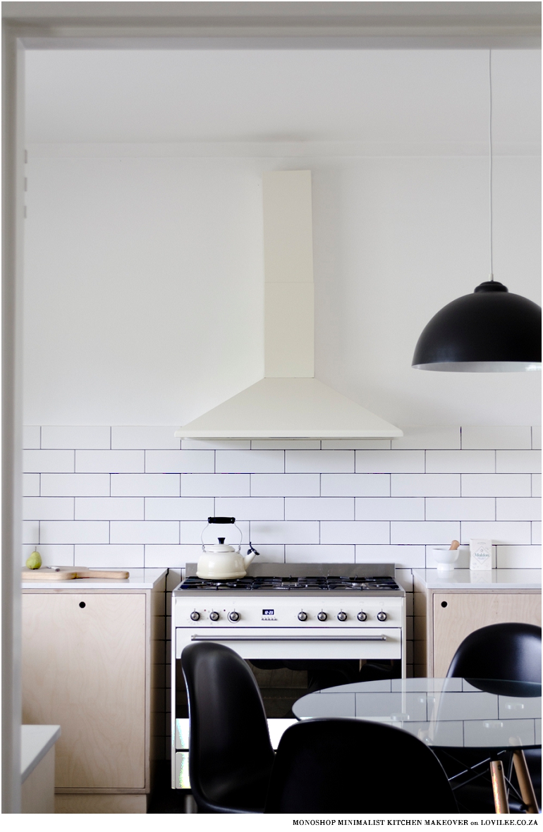 Minimalist kitchen makeover with off-shite smeg over and extractor