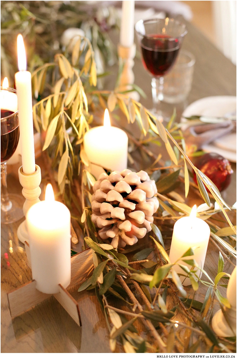 Scandinavian Christmas table decoration with olivebranches