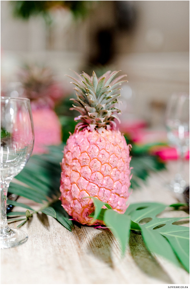 Paint pink pineapples at a tropical party