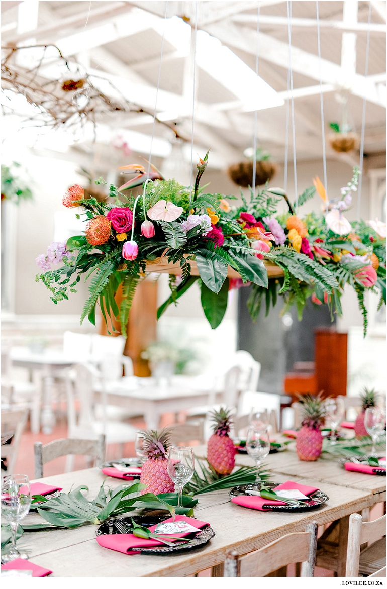 ceiling suspended tropical flowers at a flamingo party