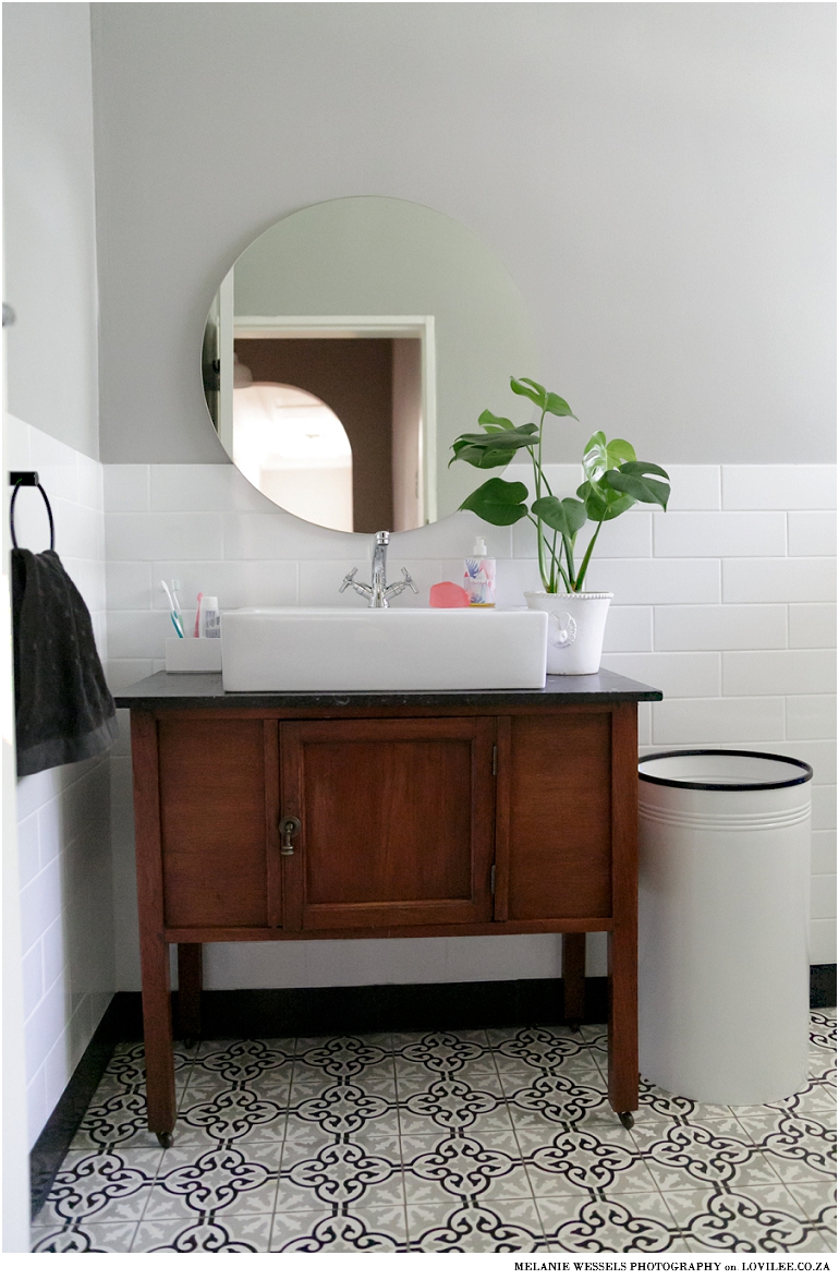 Bathroom with white subway inspired tiles and victorian style bath by Union Tiles