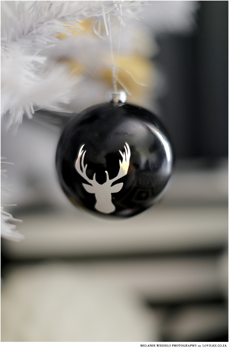 White Artificial Christmas tree with Black and gold decorations