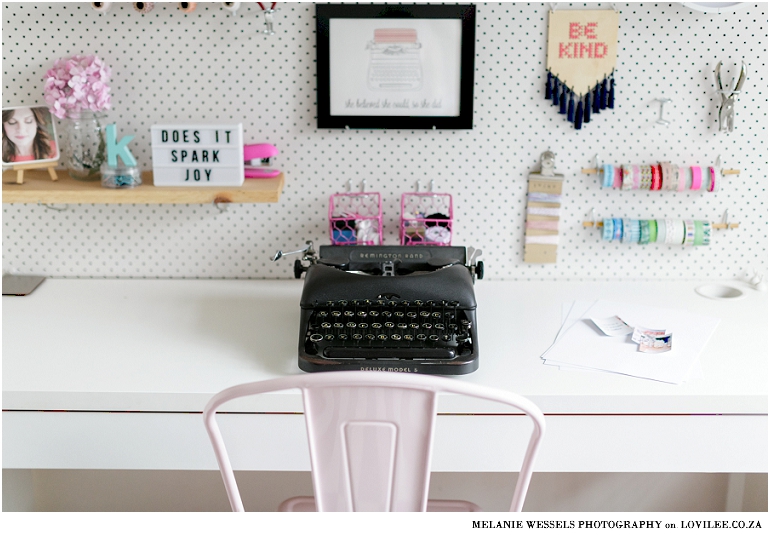 Black vintage Remington typewriter in a home office with pegboard