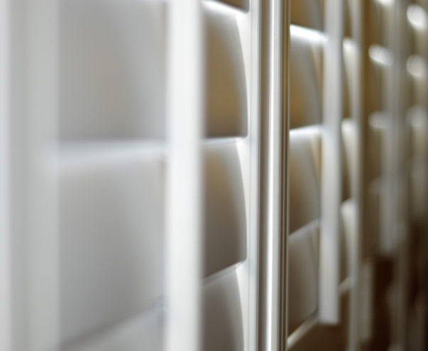 image of closed white shutters via Shutterstock
