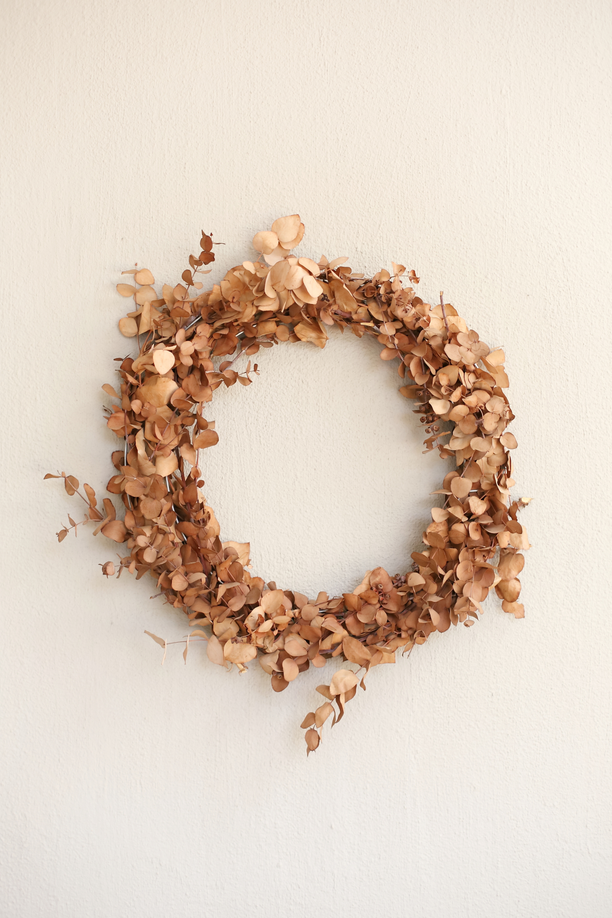 The Easiest way to make a DIY Eucalyptus Wreath - weather discolored wreath