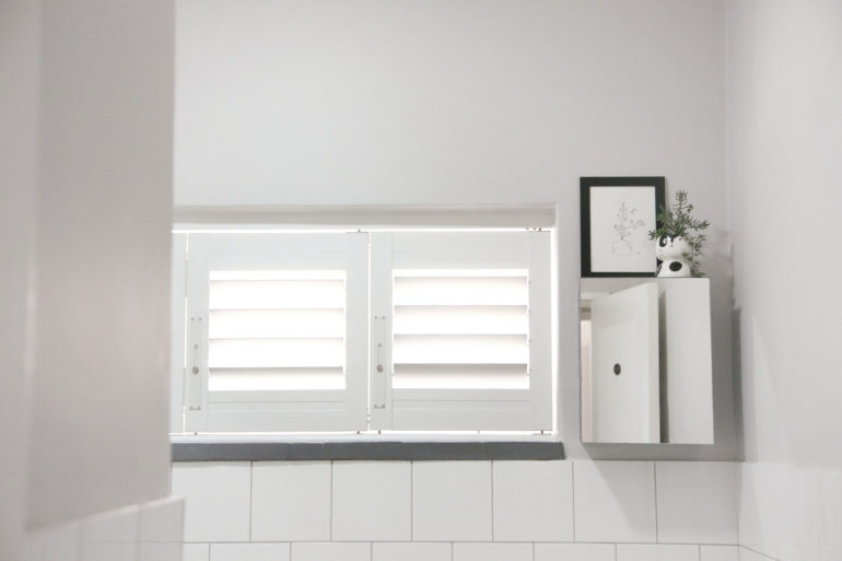 Beautiful security shutter bathroom installation by Taylor Blinds & Shutters