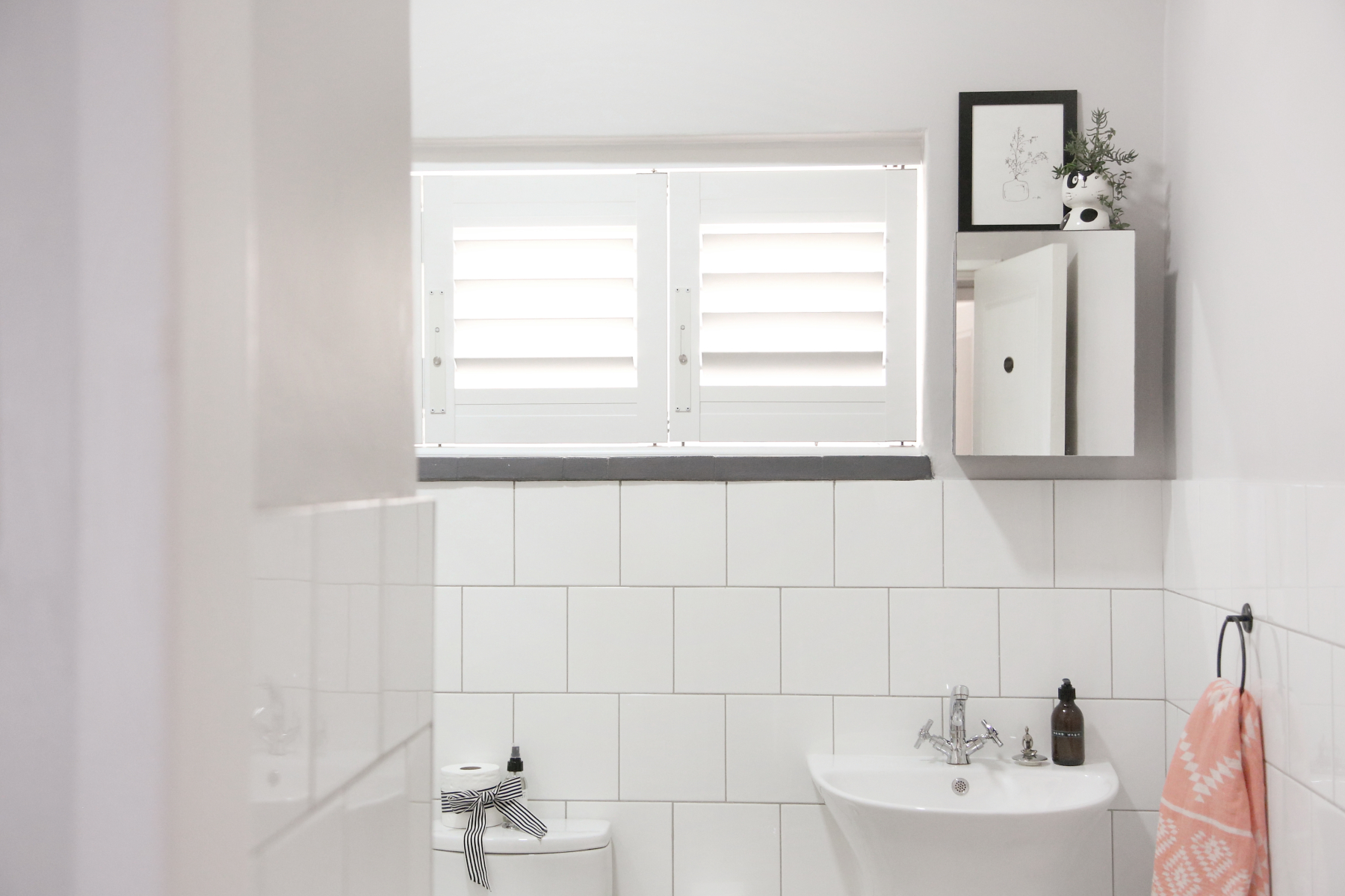 Beautiful security shutter bathroom installation by Taylor Blinds & Shutters